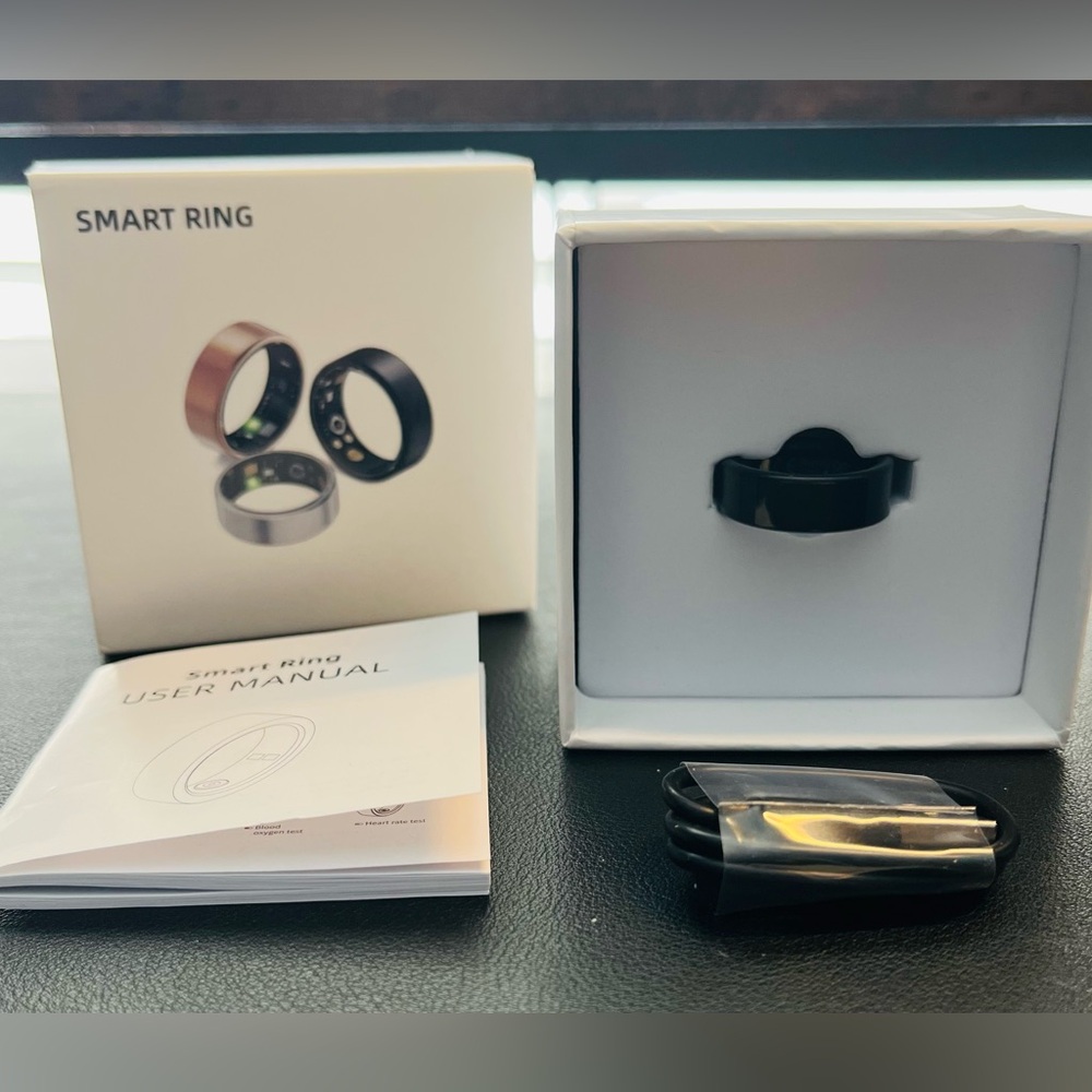 Black Smart Ring - size 8. Comes With Instructions and Charging Cord.